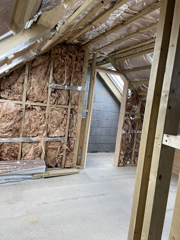 https://www.emeraldbuilders.co.uk/wp-content/uploads/2026/03/loft-conversion-underway-in-canford-heath-poole.jpg